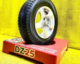 Колесо на диске Nissan 4x114.3 c шиной Dunlop 165/80R14 Колесо на диске Nissan 4x114.3 c шиной Dunlop 165/80R14