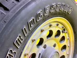 Колесо на диске Berg 5x139.7 c шиной Bridgestone 215/75R15 Колесо на диске Berg 5x139.7 c шиной Bridgestone 215/75R15