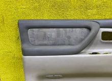Обшивка дверей TOYOTA LAND CRUISER/LAND CRUISER CYGNUS 1999 6766060050 UZJ100/UZJ100L/UZJ100/FZJ100/FZJ105/HDJ100/HDJ100L/HDJ101/HDJ101K/HZJ105/HZJ105L 2UZFE, передняя левая