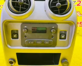 Бардачок между сиденьями General Motors