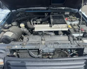 Тросик ручника Mitsubishi