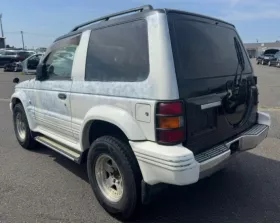 Тросик ручника Mitsubishi
