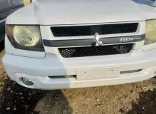 Бампер MITSUBISHI PAJERO IO 2000/Цвет W75D MR566511 H76W 4G93T, передний