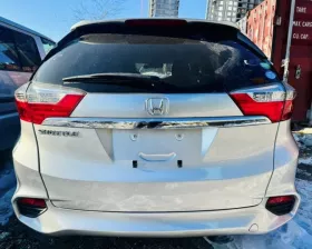 Натяжитель ремня генератора HONDA