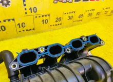 Коллектор впускной TOYOTA SIENTA 2015 1710121071 NCP175G 1NZFE, передний