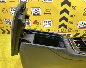 Бардачок между сиденьями Mazda