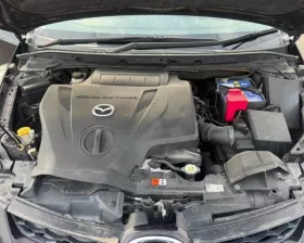 Петля капота Mazda
