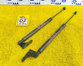 Амортизатор задней двери Nissan