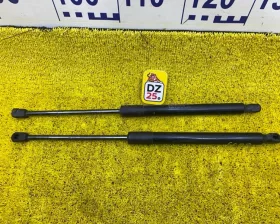 Амортизатор задней двери Nissan