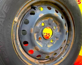 Колеса на дисках Nissan 4x114.3 c шинами Dunlop 165/80R14