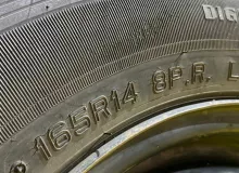 Колеса на дисках Nissan 4x114.3 c шинами Dunlop 165/80R14