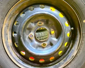 Колеса на дисках Nissan 4x114.3 c шинами Dunlop 175/80R14