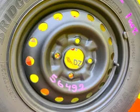 Колесо на диске Nissan 4x114.3 c шиной Bridgestone 165/80R14