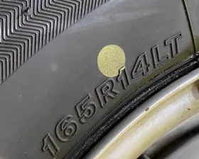 Колесо на диске Nissan 4x114.3 c шиной Bridgestone 165/80R14
