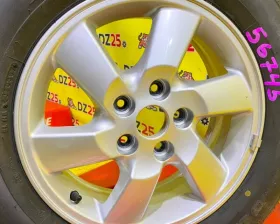 Колесо на диске Daihatsu 5x114.3 c шиной Bridgestone 215/65R16