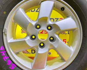 Колесо на диске Daihatsu 5x114.3 c шиной Bridgestone 215/65R16
