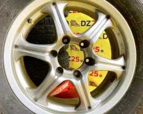 Колеса на дисках Toyota 6x139.7 c шинами Bridgestone 265/65R17