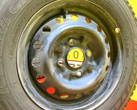 Колеса на дисках Nissan 4x114.3 c шинами Goodyear 165/80R14