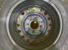 Колесо на диске Nissan 4x114.3 c шиной Bridgestone 165/80R14