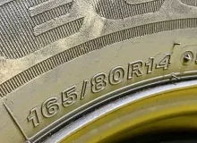 Колесо на диске Nissan 4x114.3 c шиной Bridgestone 165/80R14